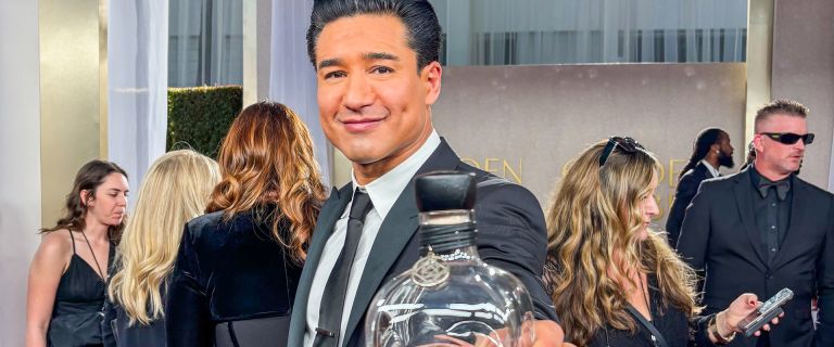 Mario Lopez at the Golden Globes holding a bottle of Casa Mexico Tequila
